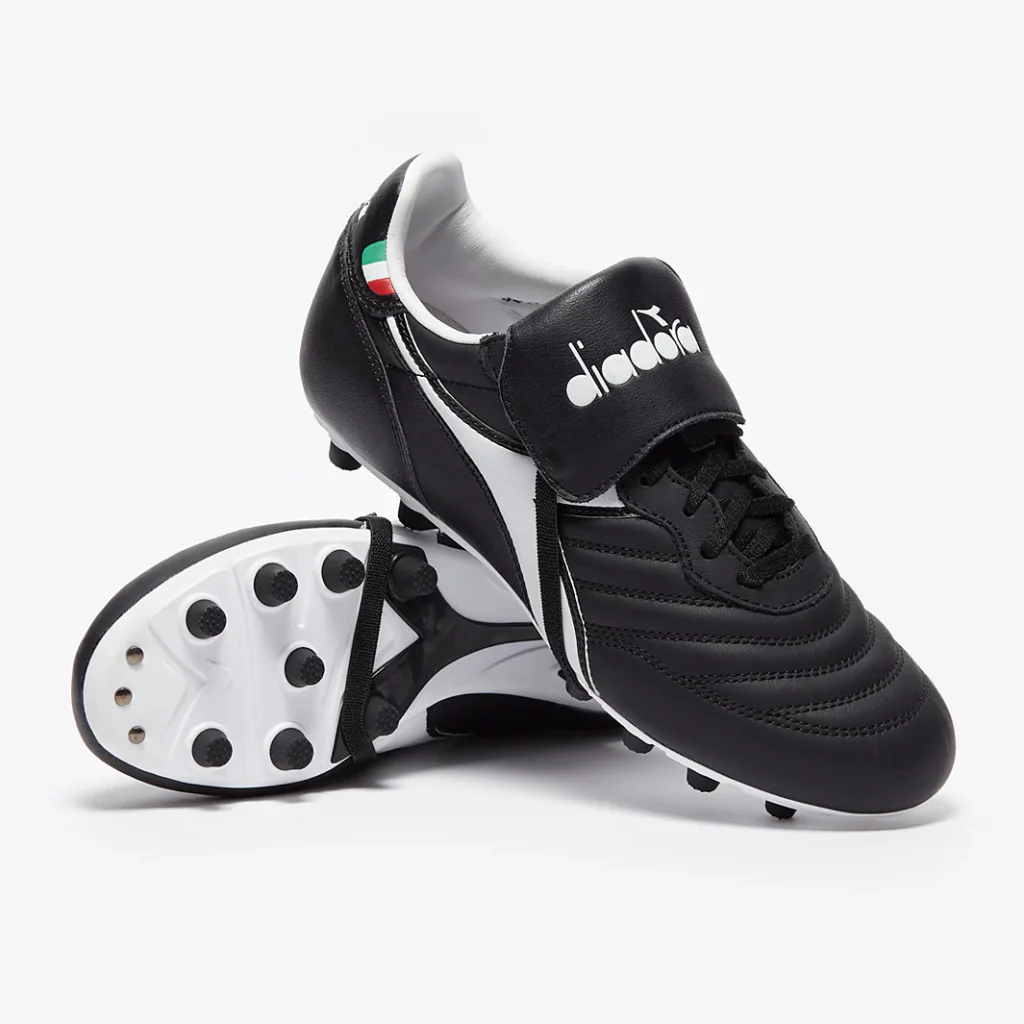 Classic black and white Diadora Brasil boots with the iconic fold-over tongue and Italian flag detail.
