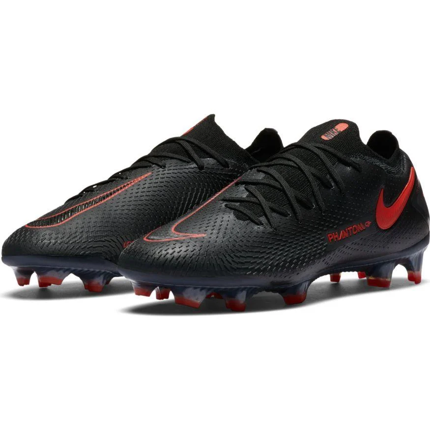 Sleek black Nike Phantom GT boots with red Nike swoosh accents and a textured upper for precision.